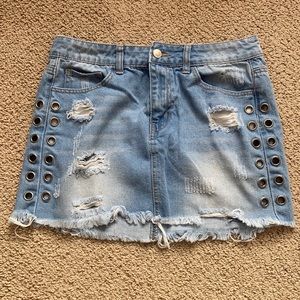 Jean Skirt with rips and metal detailing on the side